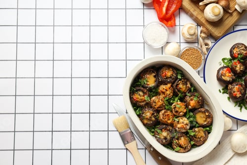 Preview: Stuffed mushrooms, vegetables and spices on light background, space for text