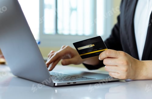 Preview: Business women hold credit cards To put information on the card to make payment via card, electronic