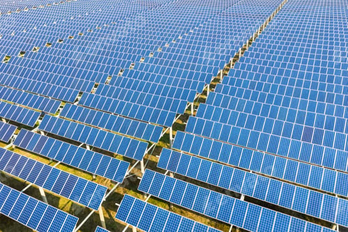Preview: arrays of blue solar panels on photovoltaic power station