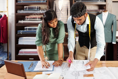 Preview: Tailors discussing fashion drawings