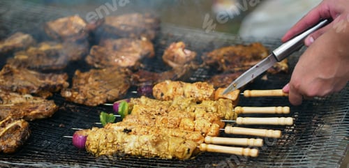Preview: Meat on stick with onion barbecue with chicken on grill.