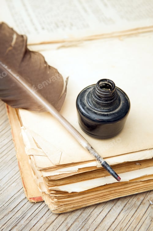 Preview: Old book, quill and black ink