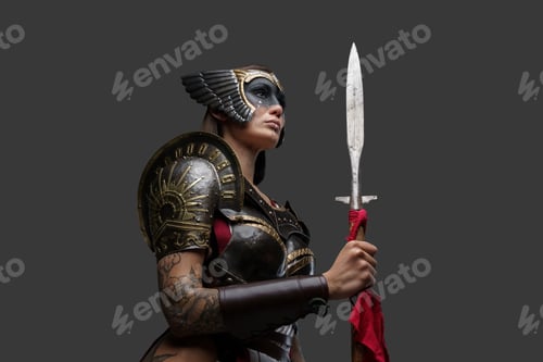 Preview: Wild amazon dressed in dark armor holding spear