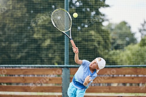 Preview: Little boy playing tennis