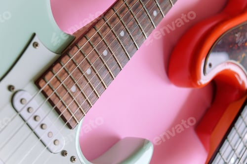 Preview: Electric guitar and bass guitar on a pink background