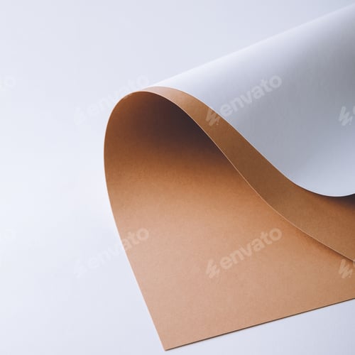 Preview: close-up view of white and brown paper sheets on grey background