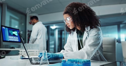 Preview: Scientist, woman and typing on laptop with test tube for chemistry, research or experiment at lab.