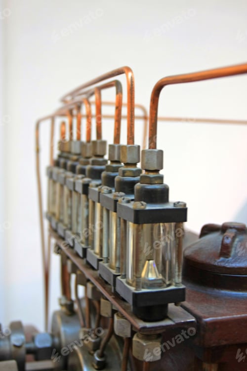 Preview: Copper Tubes Leading Into Glass Containers