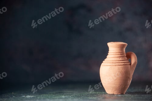 Preview: Top view of light brown empty pottery on the left side on blurred dark color background with free