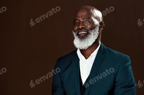 Preview: Studio shot of a mature businessman posing against a brown background
