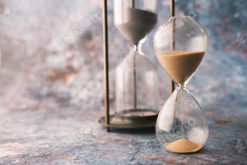 Preview: hourglass on table, sand flowing through the bulb of sandglass