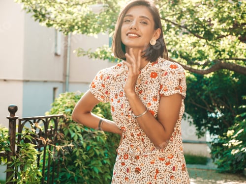 Preview: Portrait of young beautiful woman posing outdoors