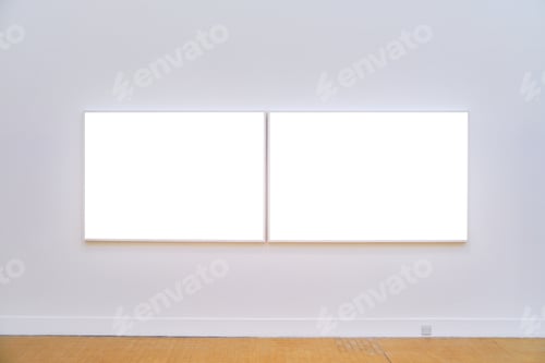 Preview: Horizontal shot of 2 empty white frames on a white wall inside of a art gallery