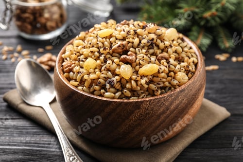 Preview: Traditional Christmas slavic dish kutia on black wooden table, closeup