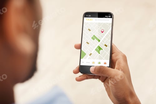 Preview: Black Man Booking Taxi Via Phone Using Application Indoors, Cropped