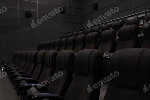 Preview: Empty cinema hall with black seats. Movie theatre nobody