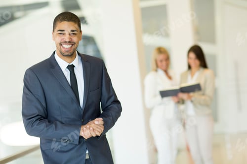 Preview: Young multiracial people working in the office