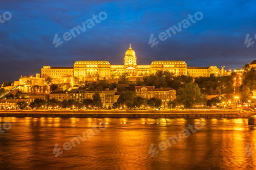 Preview: Buda Castle by the Danube river, illuminated at dusk