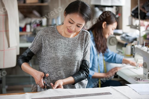 Preview: Two fashion designers working in studio