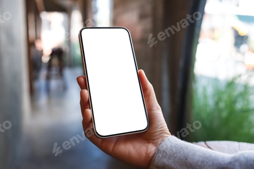 Preview: Mockup image of a woman holding mobile phone with blank desktop screen