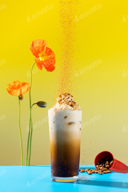 Preview: iced coffee topped with whipped cream and chocolate powder, accompanied by vibrant poppies
