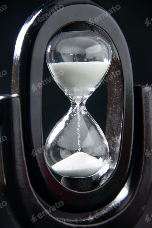 Preview: front view of black hourglass on a dark surface funeral evil israel war death time