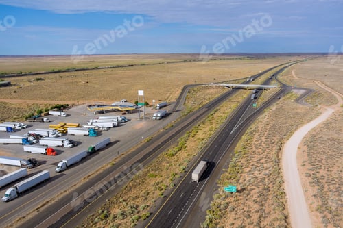 Preview: Aerial scenery top view of rest area with large car park near asphalt interstate roadside crossing o