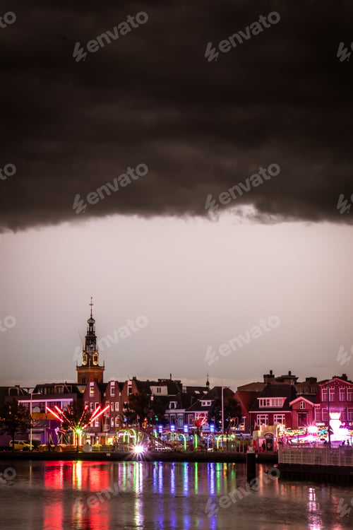 Preview: Stunning view of a bustling cityscape at night in Alkmaar