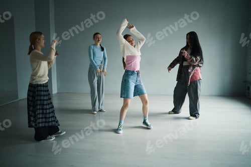 Preview: Group of People Engaging in Dance Practice in Studio