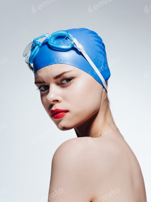 Preview: woman with bare shoulders swimming cap red lips posing sports