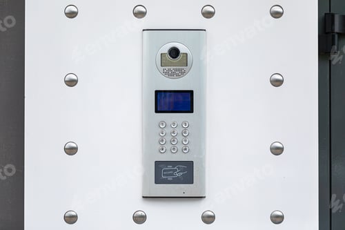Preview: Close-up of white entryphone with identification system and videocamera