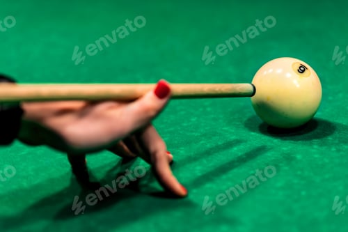 Preview: Woman's hand with cue playing pool