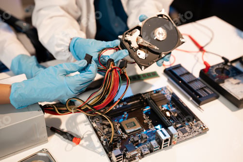 Preview: Technician measuring voltage electronic circuit board, Service after sale fix electric equipment.