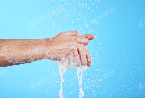 Preview: Woman, hands and water drops with soap and handwashing, skincare and hygiene on blue background. Cl