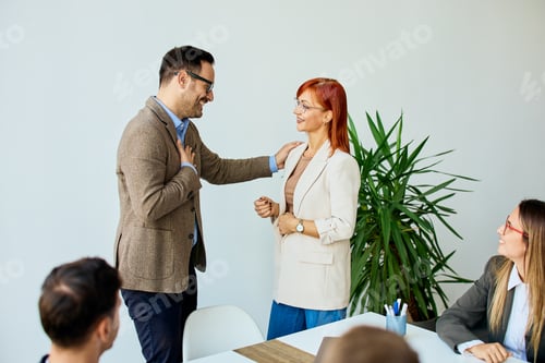 Preview: Diverse Team Engaging in a Friendly and Collaborative Office Meeting Discussion