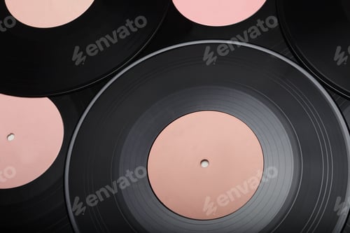 Preview: Heap of 10-inch EP vinyl records with blank pink labels.