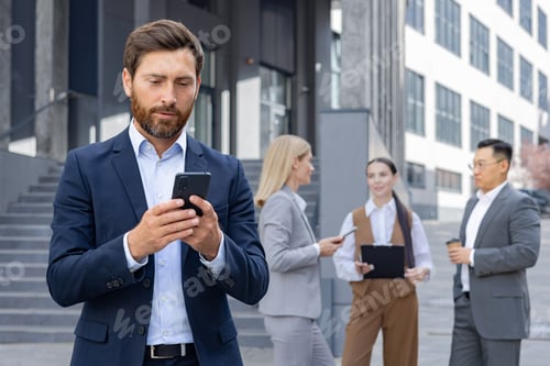 Preview: Business professionals using smartphones on corporate break