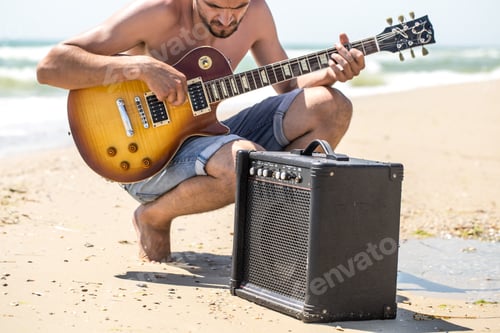 Preview: the guy on the beach with musical instruments