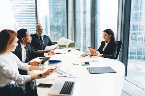 Preview: Group of diverse colleagues discussing business strategy in office with Manager