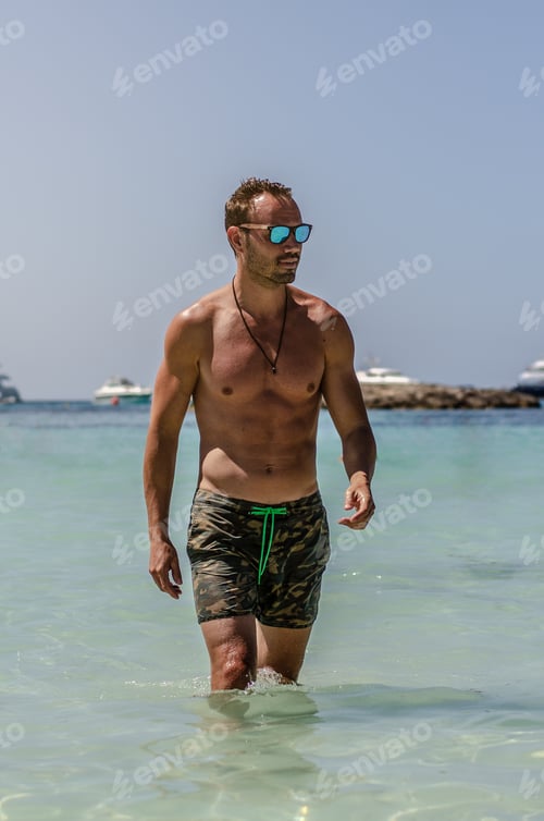 Preview: Shirtless man enjoying the beach