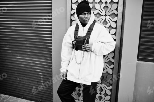 Preview: Stylish urban style african american man in pink hoodie