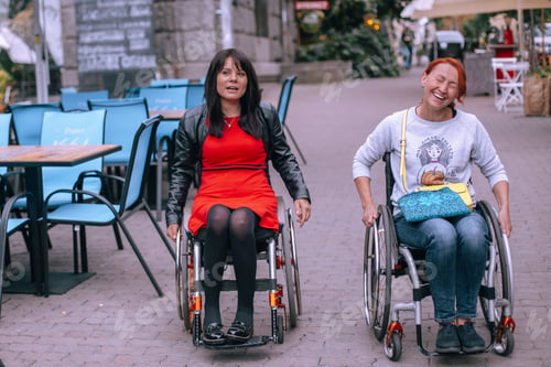 Preview: Cheerful laughing disabled women in need of help