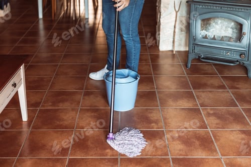 Preview: man scrubbing the living room floor