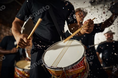 Preview: Feeling the rhythm in the drums. Closeup shot of a musical performer playing drums with his band.