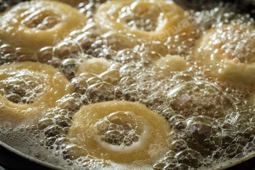 Preview: Frying fresh and tasty donuts on oil