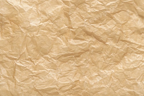 Preview: Wrinkled brown kraft paper texture with folded creases for background design and crafting projects