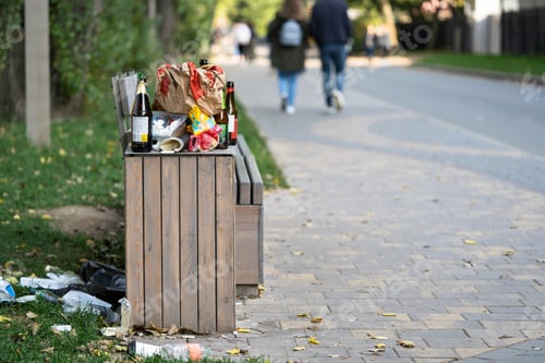 Preview: Overcrowded trash basket in the street. Garbage bin. A pile of plastic waste trash on the floor