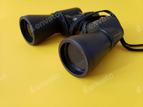 Preview: Black binoculars on simple background