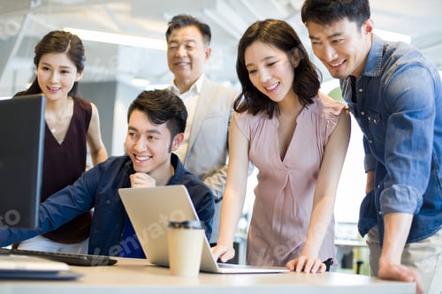 Preview: Business people working together with computer and laptop