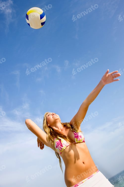 Preview: Beautiful Girl Playing Volleyball At The Beach